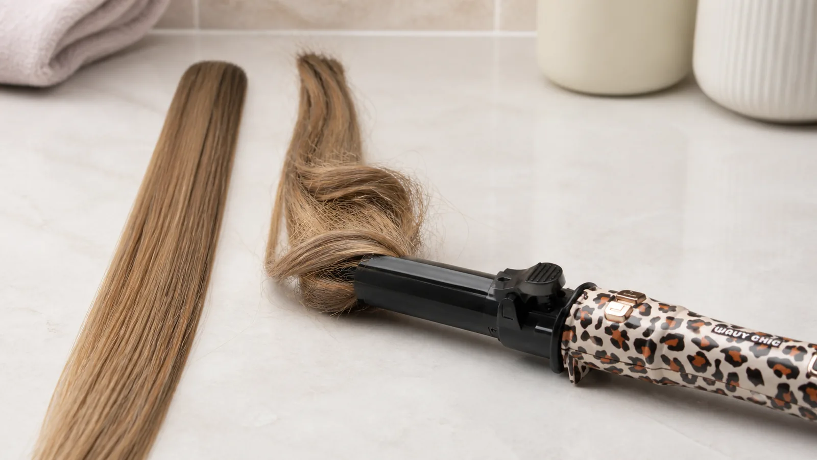Comparison of a slim combed hair section and an oversized twisted section near an automatic curler opening